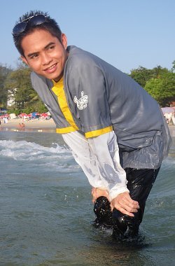 modest swimsuit sea swimming in a grey anorak